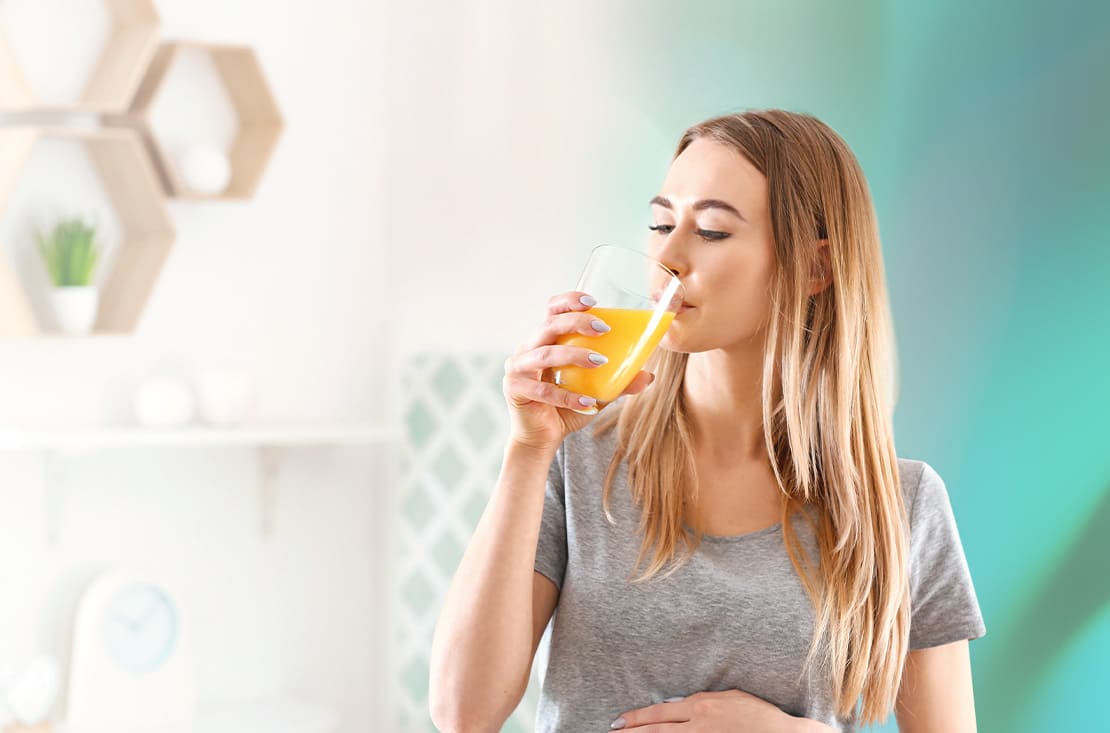 Woman drinking orange juice